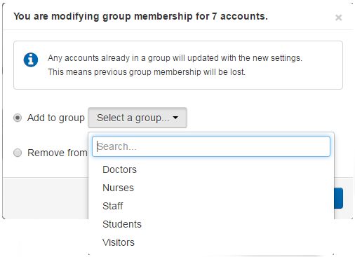 Screen headed 'You are modifying group membership for 7 accounts'. Beside an option called 'Add to group', which is currently selected, is a drop-down list showing available groups.