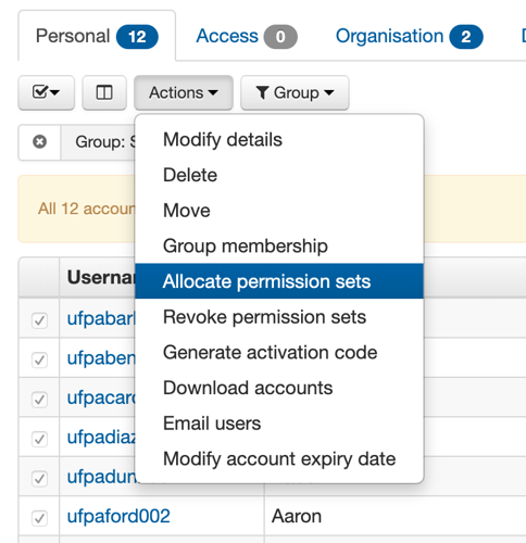 List of accounts, in which several accounts are ticked. The 'Actions' menu is open to show available actions. The action 'Allocate permission sets' is highlighted.