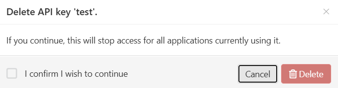 Dialog box that reads, 'Delete API key 'test'. If you continue, this will stop access for all applications currently using it.' There is a checkbox labeled 'I confirm I wish to continue', followed by 'Delete' and 'Cancel' buttons.